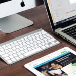 Web Hosting - Turned on Imac Beside Macbook on Table