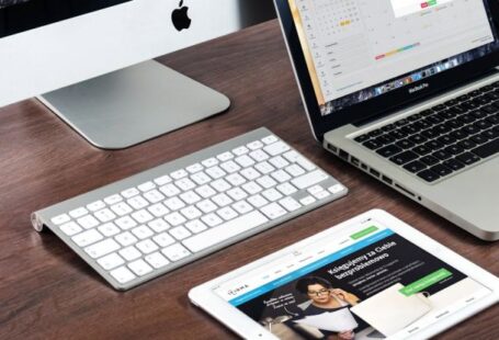 Web Hosting - Turned on Imac Beside Macbook on Table