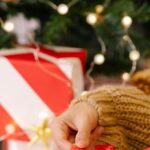 Hosting Package - Woman packaging Christmas present in box