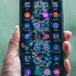 Progressive Web Apps - Crop person holding modern mobile phone