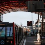 E-commerce Platform - A train is traveling through a station