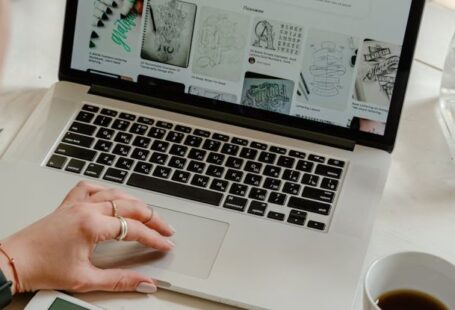 Checkout Experience - Person Using Macbook Pro on Table