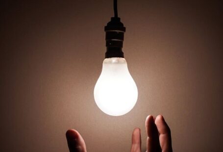 Imagery - Person Holding White Light Bulb