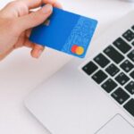 E-commerce Functionality - Person Holding Bank Card