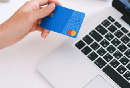 E-commerce Functionality - Person Holding Bank Card