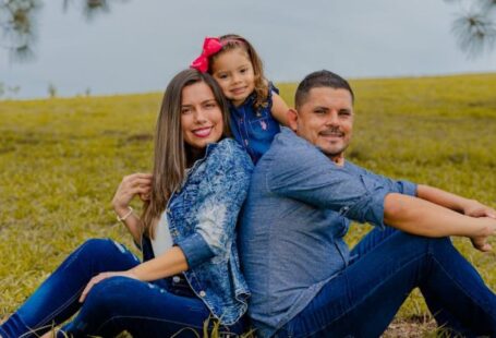 Content Workflow - A family sitting on the grass in front of a tree