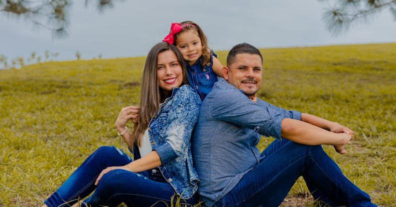 Content Workflow - A family sitting on the grass in front of a tree