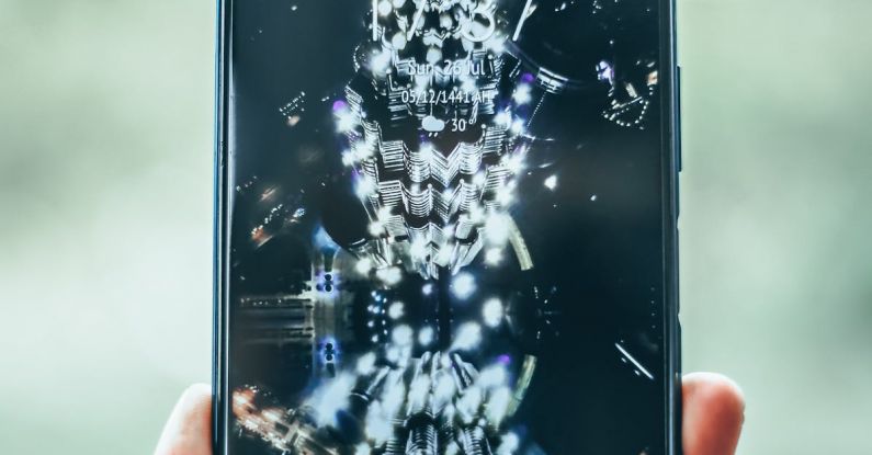 Progressive Web Apps - Crop person hand holding modern mobile phone with various apps and illuminated city on wallpaper