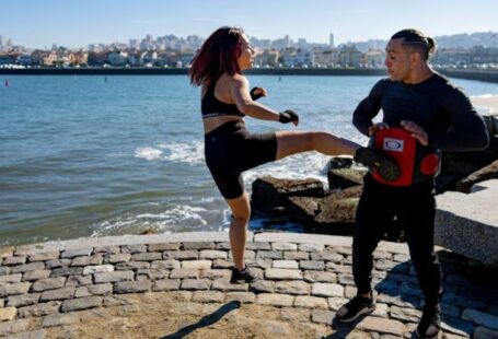 Call-to-Action - Young Asian Woman Kicking Instructor MMA Lesson